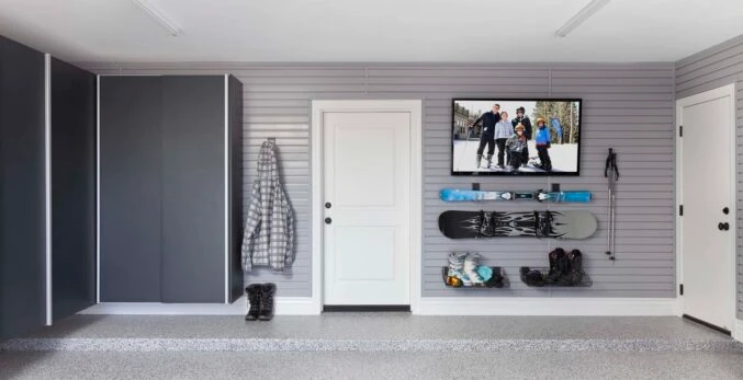 Garage with TV, skiing gear and epoxy floors