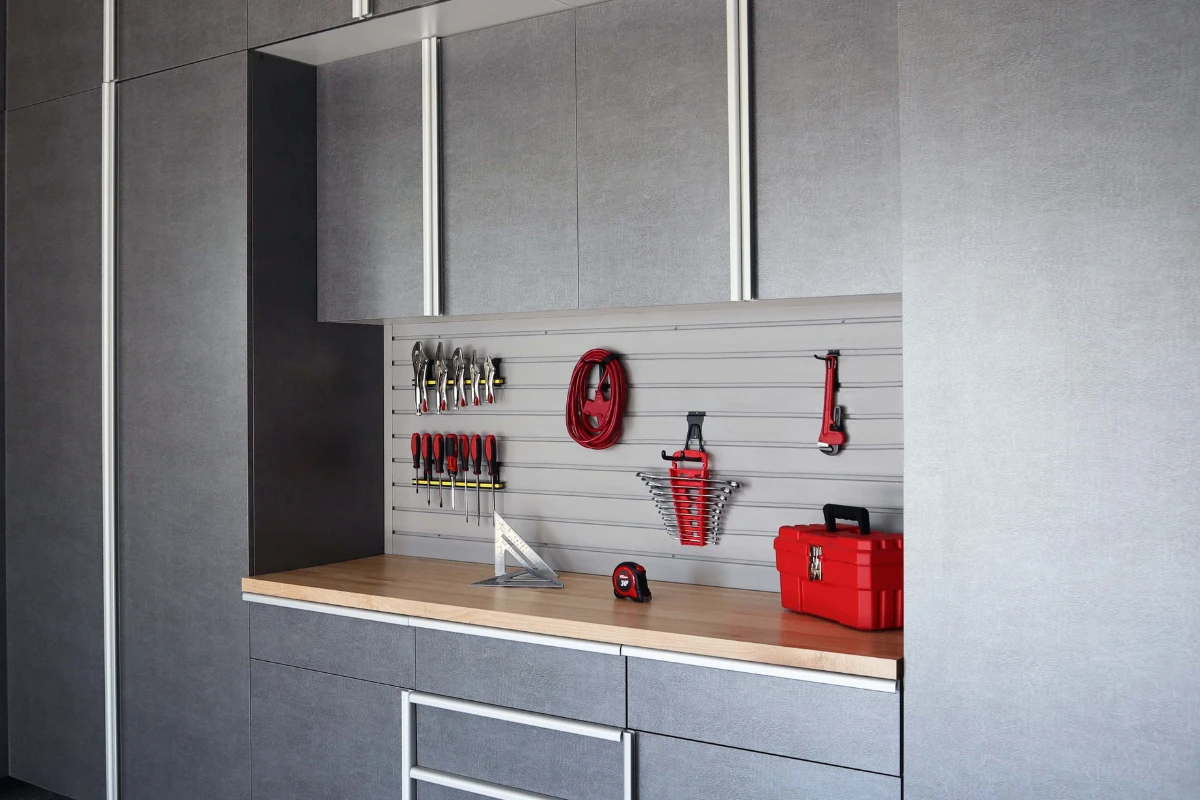 Pewter Cabinets with Butcher Block Countertop and Grey Slatwall