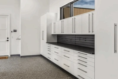 White Garage Cabinets, Ebony Star Countertop, Graphite Slatwall, Epoxy Floor