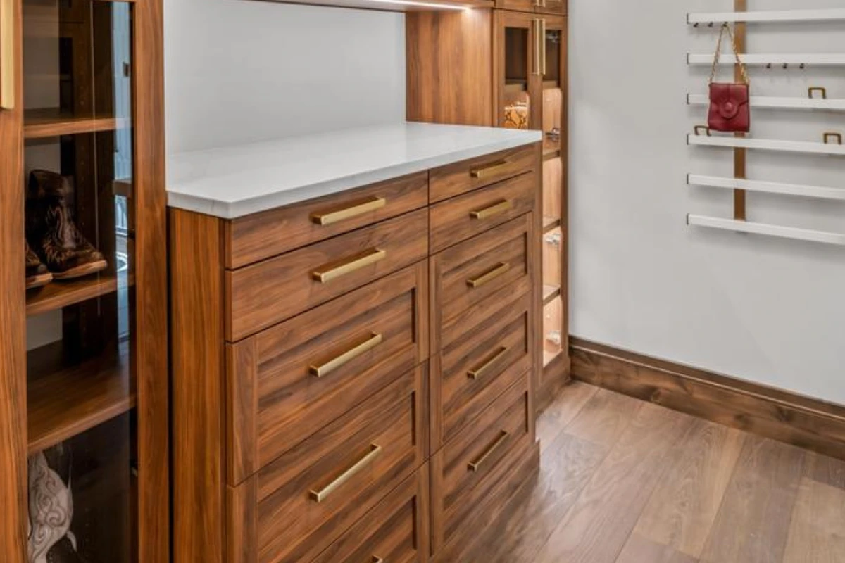 Tahoe woodgrain finish, hardware in matte gold, five-piece shaker drawer fronts
